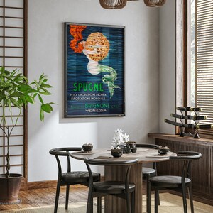 May include: A round wooden dining table with four black chairs. The table is set with a white vase with white flowers, a bowl of chopsticks, and a bowl of soy sauce. A vintage poster with a mermaid and the text "SPUGNE FELICA LAVORAZIONE PROPRIA ESPORTAZIONE MONDIALE BENEDETTO BRIGNONE & FIGLI VENEZIA" hangs on the wall behind the table.