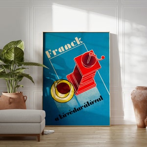 May include: A vintage poster with a blue background and the text "Frack a k&aacute;v&eacute;dar&aacute;l&oacute;val" in white. The poster features a red coffee grinder with a yellow cup and saucer.