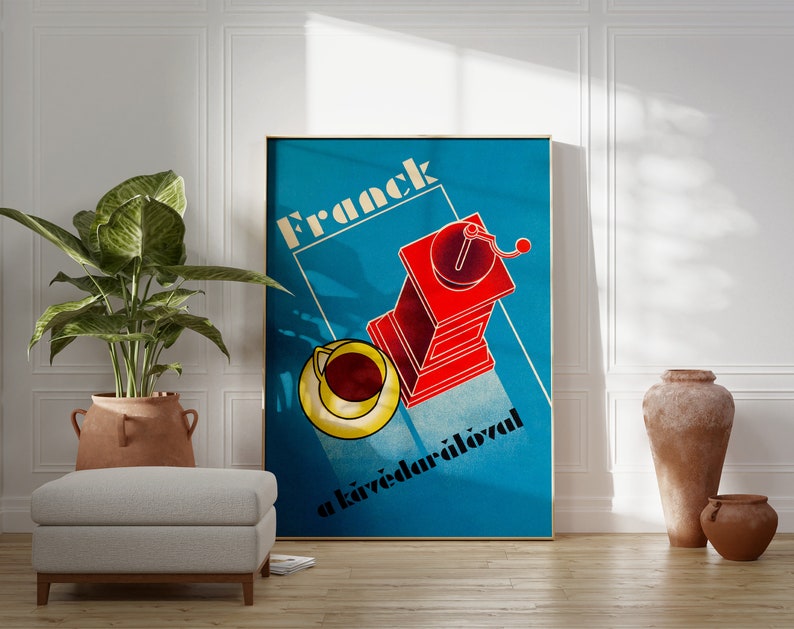 May include: A vintage poster with a blue background and the text "Frack a k&aacute;v&eacute;dar&aacute;l&oacute;val" in white. The poster features a red coffee grinder with a yellow cup and saucer.