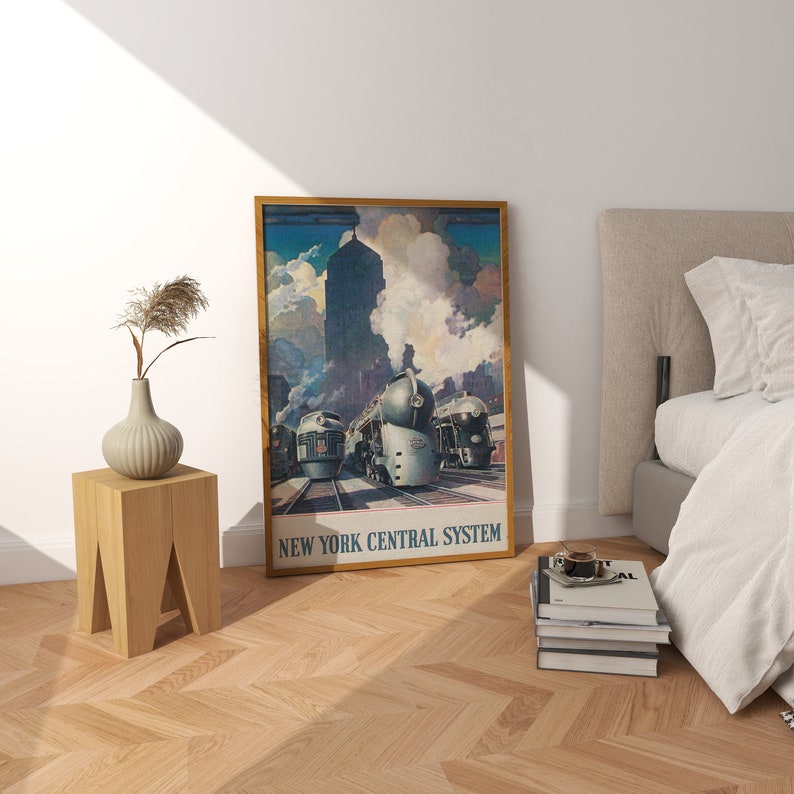 May include: A vintage poster featuring a New York Central System train with three locomotives. The poster is framed in gold and has a blue, gray, and white color scheme. The text "New York Central System" is printed at the bottom of the poster.