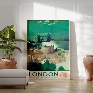 May include: Vintage travel poster featuring a colorful illustration of Tower Bridge in London, England. The poster has a green background with the text "LONDON GWR ENQUIRE FOR CHEAP TICKET FACILITIES".