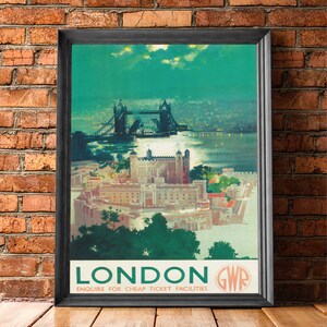 May include: Vintage travel poster advertising a trip to London, England. The poster features a nighttime view of Tower Bridge and the Tower of London. The poster is in green, blue, and white colors with the text "LONDON GWR ENQUIRE FOR CHEAP TICKET FACILITIES".