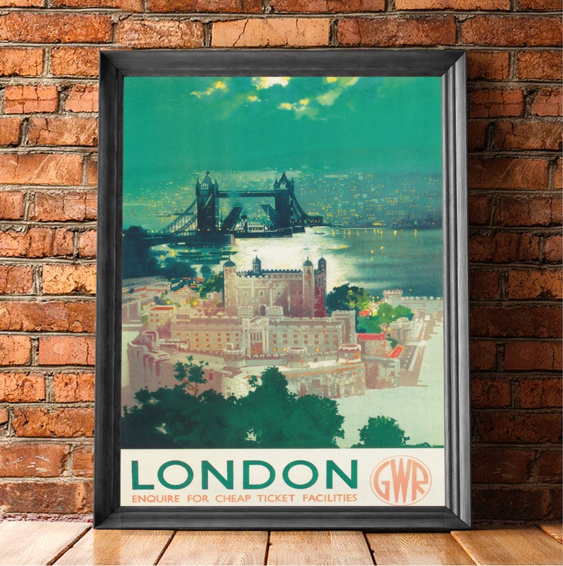 May include: Vintage travel poster advertising a trip to London, England. The poster features a nighttime view of Tower Bridge and the Tower of London. The poster is in green, blue, and white colors with the text "LONDON GWR ENQUIRE FOR CHEAP TICKET FACILITIES".