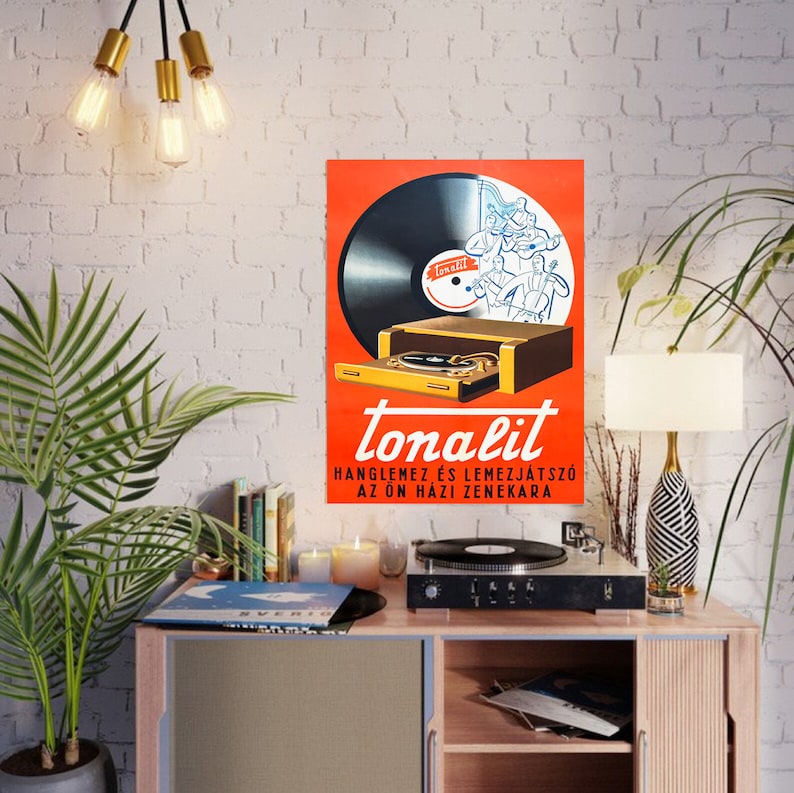 May include: A vintage advertisement for the "tonalit" record player and phonograph. The ad features a red background with a black record, a gold record player, and a group of musicians playing instruments. The text reads "tonalit" and "hangl&eacute;m&eacute;z &eacute;s lemezj&aacute;tsz&oacute; az &ouml;n h&aacute;zi zenekara".