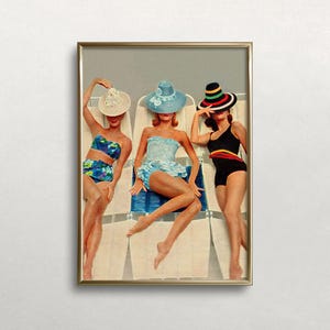 May include: Three women wearing colorful hats and swimsuits are relaxing on lounge chairs. The women are wearing blue, white, and black swimsuits. The lounge chairs are white with blue stripes.