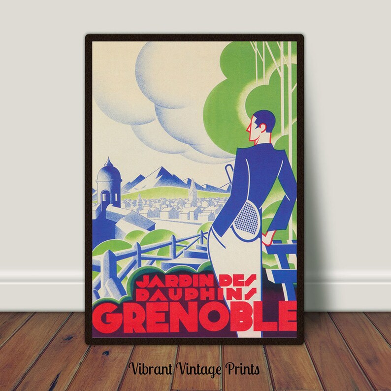 May include: Vintage travel poster for Jardin des Dauphins, Grenoble. The art deco style poster features a man with a tennis racket overlooking a city with mountains in the background. The poster is framed in a dark brown frame.