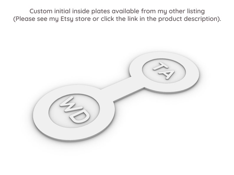 May include: Two white, round, connected plates with the initials "WD" and "TA" printed on them.
