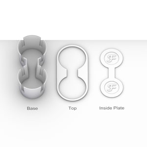 May include: A white plastic cup holder with two separate compartments. The cup holder is made up of three parts: a base, a top, and an inside plate. The inside plate has the letter "F" printed on it.