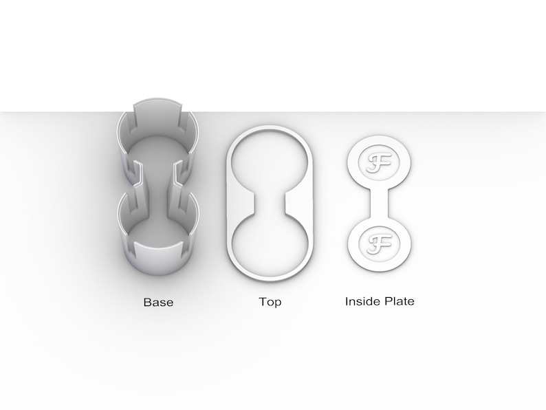 May include: A white plastic cup holder with two separate compartments. The cup holder is made up of three parts: a base, a top, and an inside plate. The inside plate has the letter "F" printed on it.