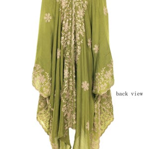 May include: Olive green embroidered tunic with a V-neck and wide sleeves. The tunic features intricate floral embroidery in a contrasting beige color, with the words "back view" visible.