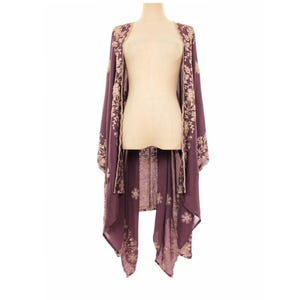 May include: A deep purple open-front kimono featuring long, flowing sleeves and a light beige floral embroidery pattern along the front edges and hemline. The garment has a loose, draped silhouette with a lightweight, semi-sheer fabric construction.