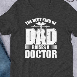 The Best Dad Raises a Doctor Shirt, RN Dad Sweater, Proud Dad of Son or Daughter Doctor Short-Sleeve Unisex T-Shirt