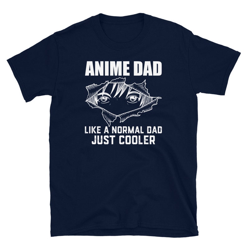 May include: Navy blue t-shirt with white text that reads "Anime Dad Like a Normal Dad Just Cooler". The shirt features a white graphic of an anime character's eyes peeking out from behind a torn piece of paper.