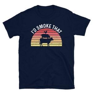 May include: Navy blue t-shirt with a retro sunset graphic and the text "I'd Smoke That". The graphic features a chicken, pig, and cow stacked on top of each other.