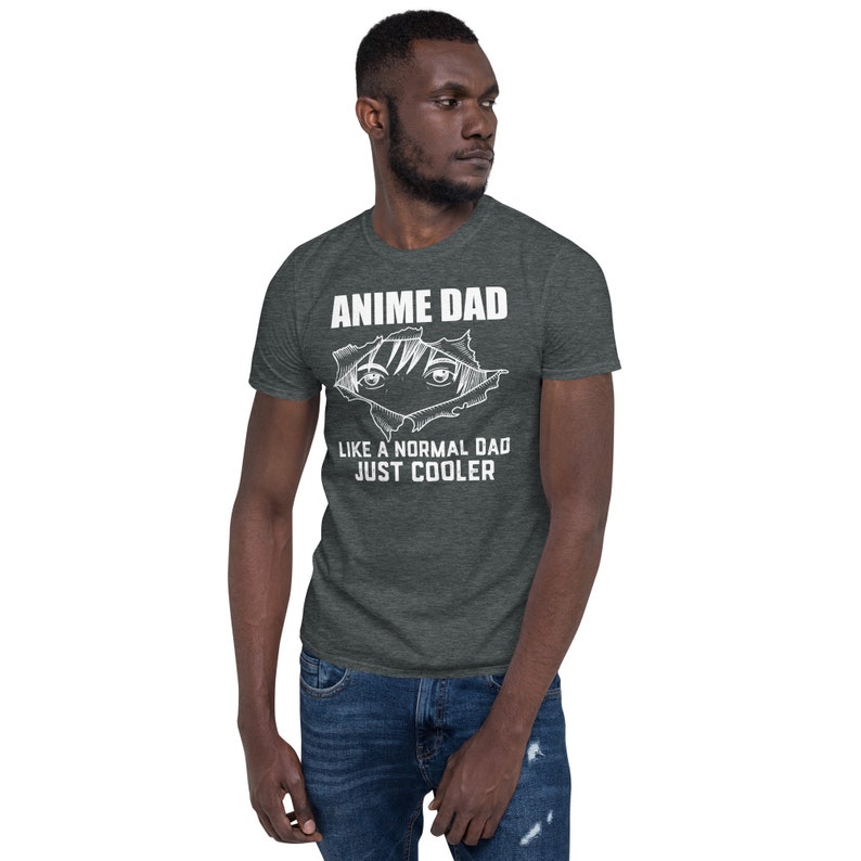 May include: A dark heather grey t-shirt with a white graphic of anime eyes peeking out of a ripped hole. The text "Anime Dad" is above the eyes and "Like a normal dad just cooler" is below the eyes.