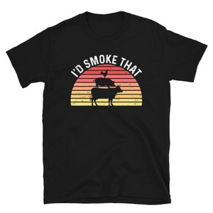 May include: Black t-shirt with a retro sunset graphic and the text "I'd Smoke That". The graphic features a chicken, pig, and cow stacked on top of each other.