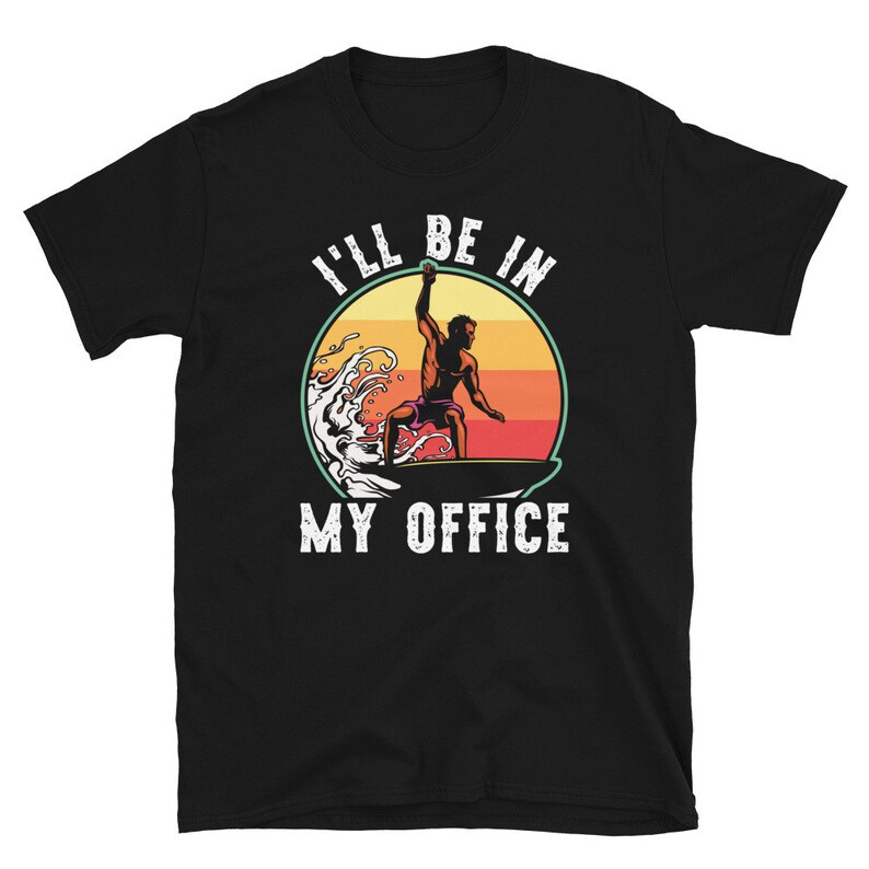 May include: Black t-shirt with a white graphic of a person surfing on a wave with the text "I'll be in my office".