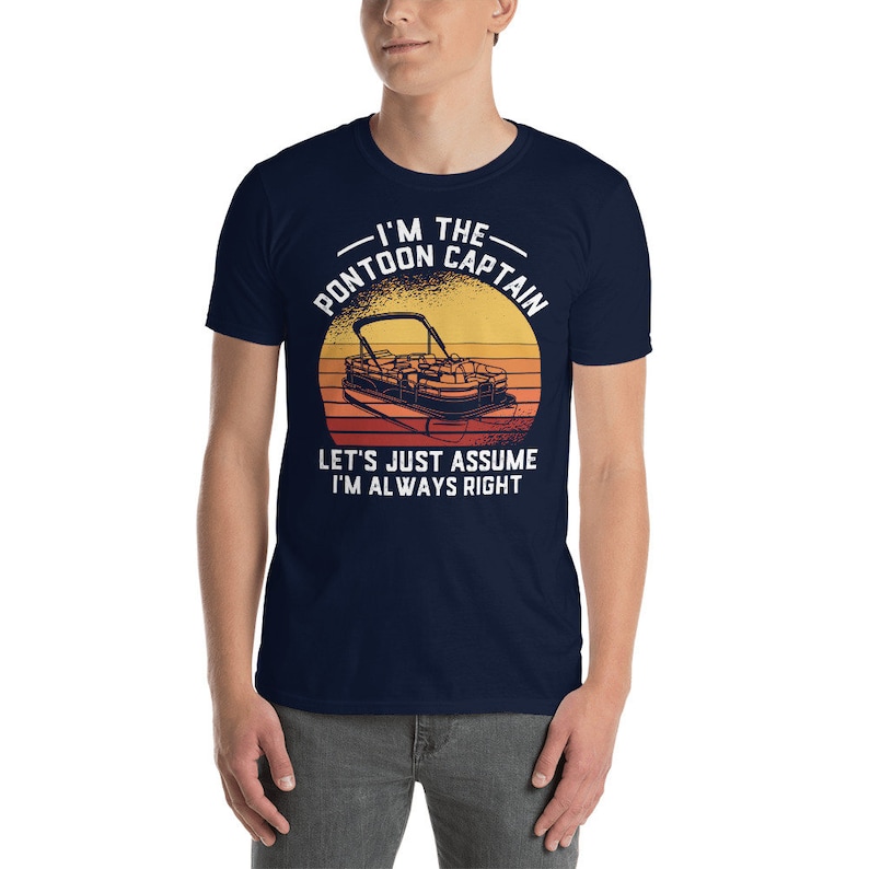 May include: A navy blue t-shirt with a vintage-style graphic of a pontoon boat and the text "I'm the Pontoon Captain. Let's just assume I'm always right."