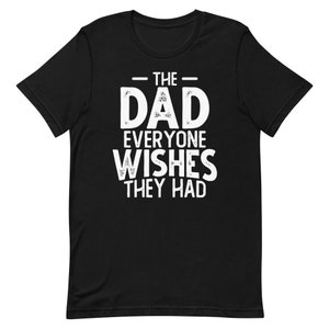 May include: Black t-shirt with white text that reads "The Dad Everyone Wishes They Had".