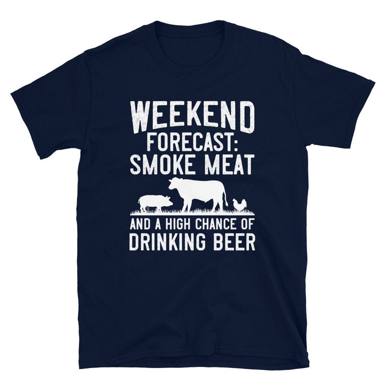 May include: Navy blue t-shirt with white text that reads "Weekend Forecast: Smoke Meat and a High Chance of Drinking Beer". The shirt features a silhouette of a cow, pig, and chicken.