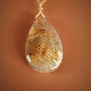 Golden rutilated quartz pendant