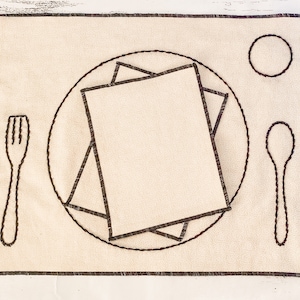 May include: A beige placemat with a brown embroidered design of a plate, fork, spoon, and a small circle. The design is simple and minimalist.