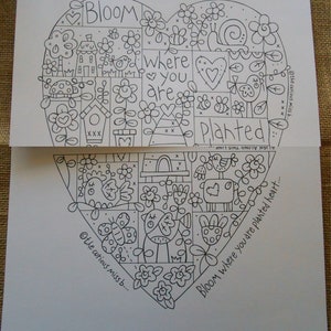 May include: Black and white line art illustration of a heart with the text "Bloom where you are planted heart." inside. The heart is filled with various floral and animal illustrations, including birds, flowers, a snail, a beehive, and a house.