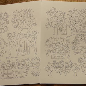 May include: Black and white coloring page with illustrations of various animals and flowers. The page features the word "Mum" repeated throughout the design. The text "Fabulous Mum" is also included.