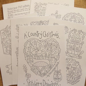 May include: A black and white printable pattern sheet for a cross stitch design titled "A Country Christmas" by the Curious Miss B. The design features a reindeer with a heart-shaped outline filled with Christmas symbols and a small bird.