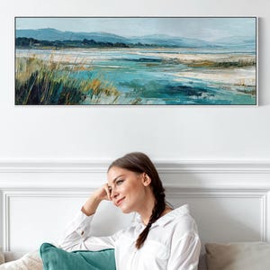 May include: A panoramic landscape painting featuring a coastal scene with turquoise and blue water, sandy tidal flats, and tall grasses in the foreground. The background displays rolling hills under a soft, overcast sky in muted tones.
