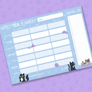 May include: A light blue weekly meal planner with a cat theme. The planner includes sections for each day of the week, breakfast, lunch, and dinner, and a shopping list. Decorative elements include cat illustrations and yarn balls.