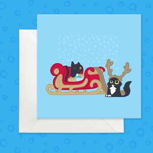 Carte mignonne de chats noirs et de traîneau, carte drôle de chat noir de vacances, carte de Noël bleu glacier douce avec des chats, carte d'amant de chat de Noël
