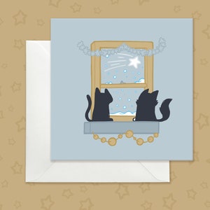 Carte de Noël de chats noirs sur le rebord de la fenêtre, carte de Noël argentée mignonne avec des chats, carte de Noël de chats noirs et d'étoile filante, carte de Noël de smoking