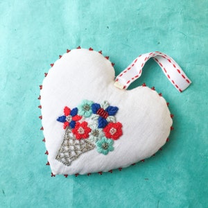 Lavender heart pomander with Flower Basket embroidery (blue, turquoise, red on white linen - red edge)