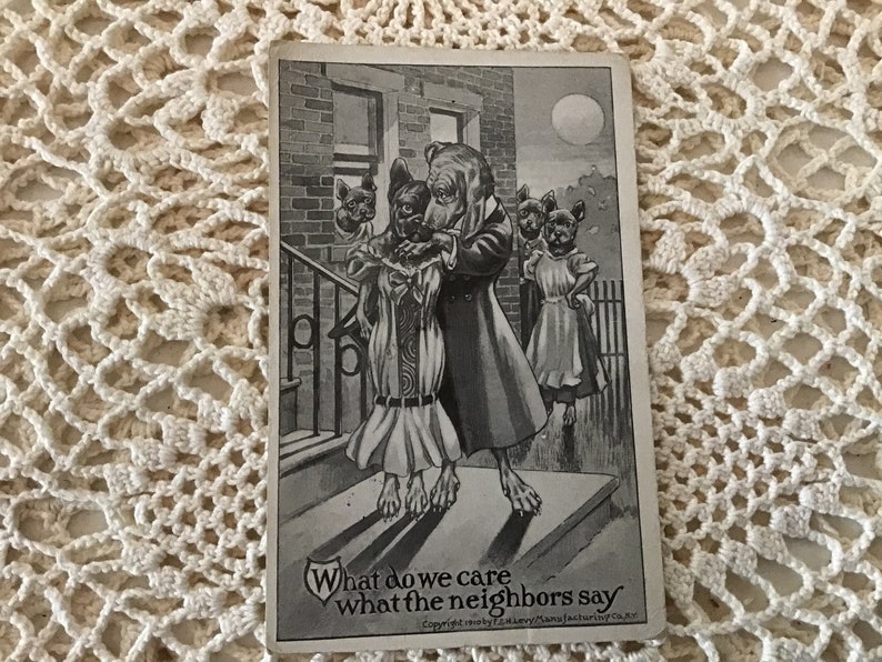 May include: Black and white illustration of four dogs dressed in clothing. The dog in the center is kissing another dog on the cheek. The caption reads "What do we care what the neighbors say".