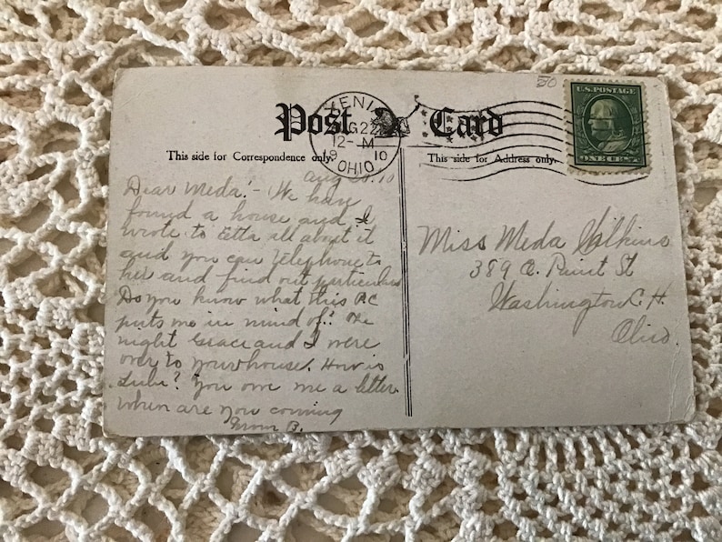 May include: A vintage postcard with a handwritten message. The message reads: "Dear Meda, I today found a house and wrote to tell all about it and you can telephone this and find out particulars. Do you know what this ac puts me in mind of... I might because I were ready to go and I more.  I will you on me a letter. When are you coming. Your B."