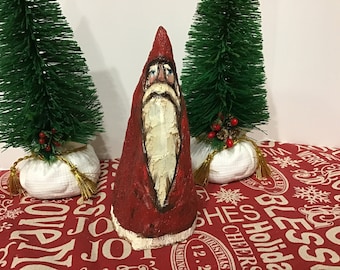 Figura de Papá Noel tallada a mano, escultura artística firmada, decoración navideña, objeto de colección.