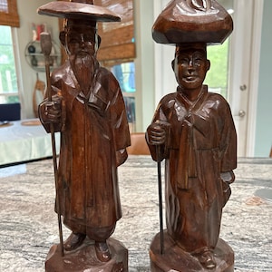 Pair of handcarved wooden Asian male figures - 18 inches tall