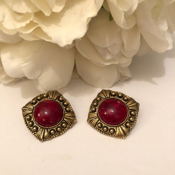 Fun Unsigned Vintage Clip on Earrings Weighty Gold Tone Metal and Red Swirl Glass Stones