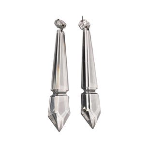 May include: Two clear crystal chandelier pendants with faceted edges and a decorative top. The pendants are elongated, tapering to a point, and are suspended against a white background. The crystal reflects light, creating a sparkling effect.