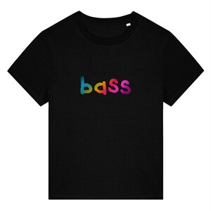 May include: Black crew neck t-shirt with the word "bass" in a rainbow gradient across the chest. The word transitions from blue to green, orange, and pink.