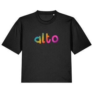 May include: Black, short-sleeved t-shirt with the word "alto" in rainbow-colored lettering across the chest. The word is written in a playful, rounded font. The shirt has a crew neck and a relaxed fit.