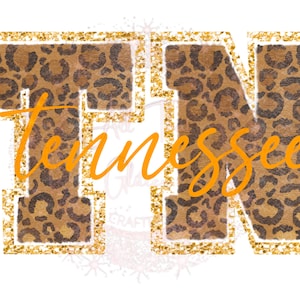 May include: Gold glitter letters spelling "TN" with a leopard print pattern inside the letters. The word "Tennessee" is written in orange cursive below the letters.