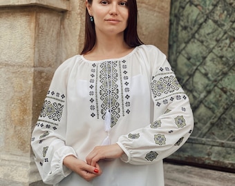 White embroidered chiffon blouse Ukrainian shirt with traditional design. Vyshyvanka shirt with folk embroidery.