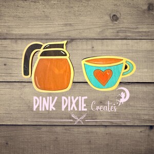 May include: A wooden cutout of an orange coffee carafe with a black handle and a matching teal teacup featuring an orange heart design. Below the items, the text PINK PIXIE Creates is displayed in a light pink font with a small fairy graphic.