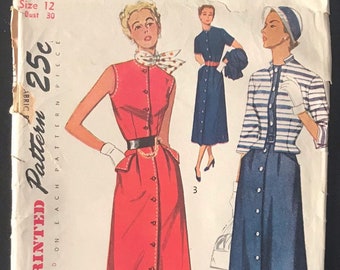 May include: Vintage Simplicity sewing pattern number 3156 for a dress. The pattern is printed on a white paper background and features three illustrations of women wearing different versions of the dress. The dress is a button-front style with a collar and a belt. The pattern includes instructions for sizes 12 and 30 bust.