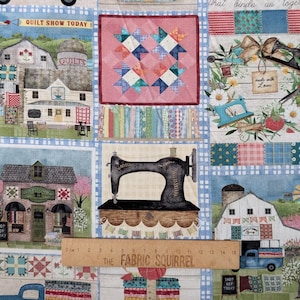 May include: Patchwork fabric featuring a quilting theme. The design includes images of barns, sewing machines, and quilt blocks. The text "QUILT SHOW TODAY" and "SHOP HOP TODAY" are visible. The fabric is approximately 15 cm wide.