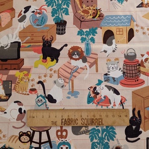 May include: A beige fabric with a repeating pattern of cats in various poses and settings. The cats are depicted in a cartoon style with bright colours and playful details. The fabric features a ruler with the text "THE FABRIC SQUIRREL" printed on it.