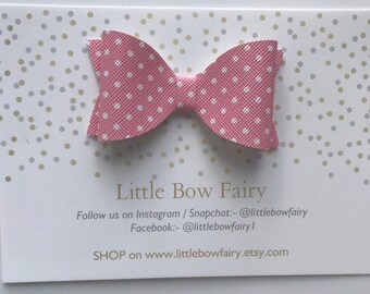 Faux leather pink polka dot bow