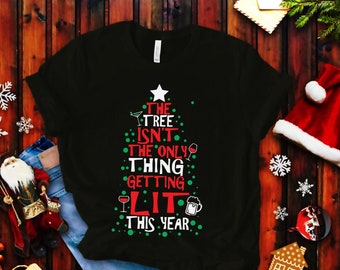 Funny Christmas T-Shirt: The Tree Isn't The Only Thing Getting Lit